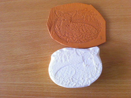 embossing plate fawn lying down